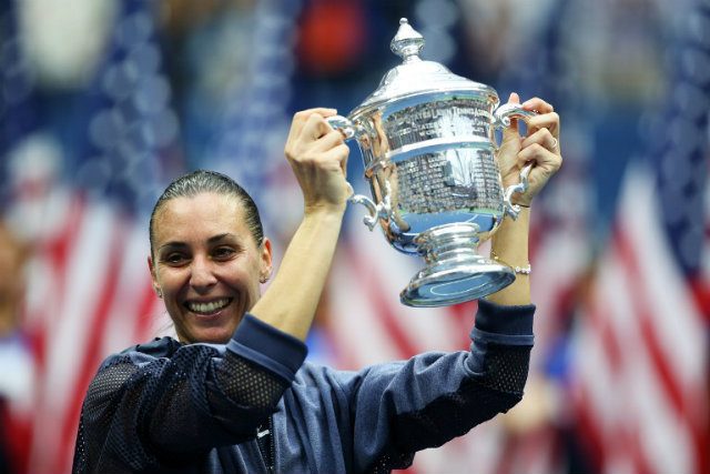 OUT WITH A BANG. Flavia Pennetta leaves the sport on as high a note as she could've dreamed. Photo by Matthew Stockman/Getty Images/AFP 