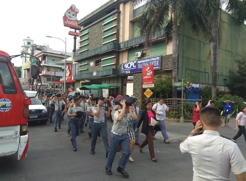 WEST QUADRANT. Employees evacuate the building during the earthquake drill. Photo by Bunsim San/Rappler 
