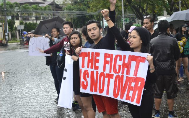NEW GENERATION. Millennials lead the protest against the Marcos burial in Iloilo City. Photo by Russel Patina/Rappler  