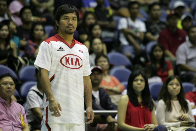 KIA Carnival coach Manny Pacquiao watches from the sidelines as his team becomes the third straight victim of Barako Bull Energy Cola  