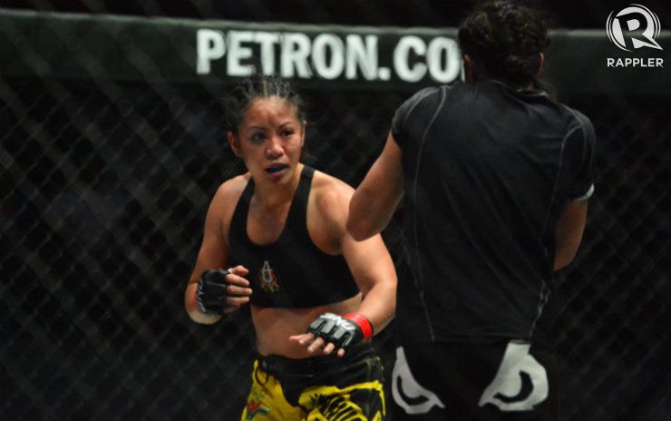 Ana Julaton sets up her offense against Aya Saber. Photo by Nevin Reyes/Rappler