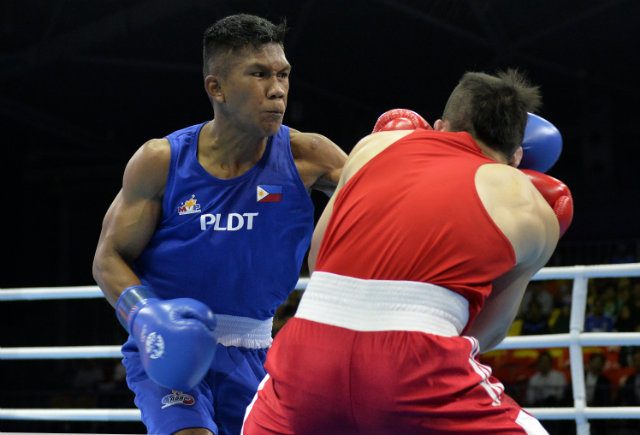 Eumir Marcial lands a straight left on Jia Wey Tay of Singapore. Photo by Singapore SEA Games Organising Committee/Action Images via Reuters 