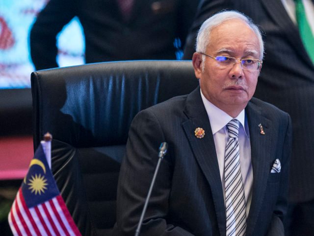 Malaysia ruling party to meet with PM under fire