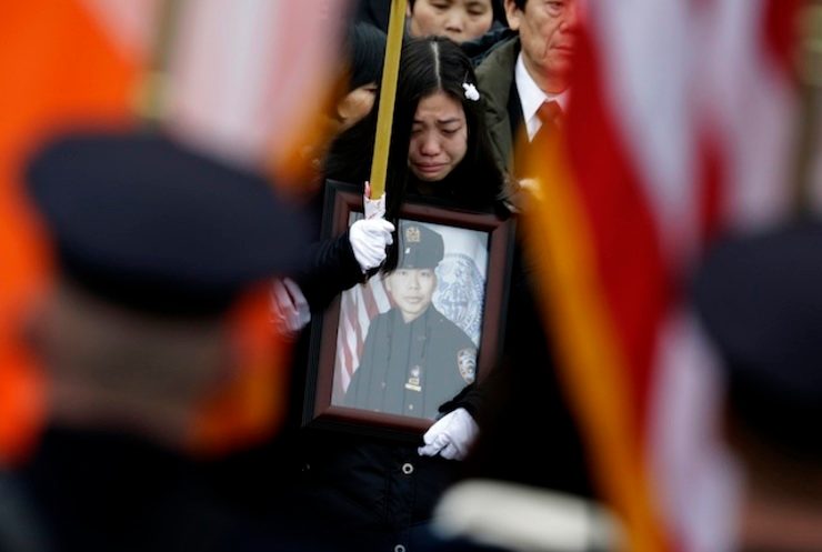 Thousands bid farewell to murdered New York cop