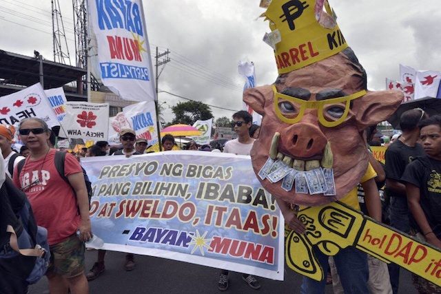 DEMANDS. Protesters gather ahead of the 5th State of the Nation Address of President Benigno Aquino III on Monday, July 28. Photo by Leanne Jazul/Rappler