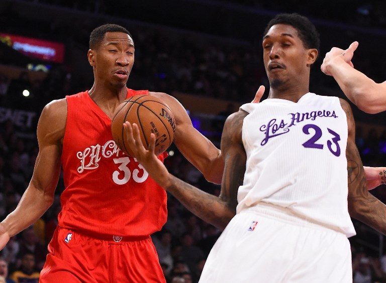 A squinty Wesley Johnson (Clippers) and Lou Williams (Lakers) show off their team colors. Photo by Jayne Kamin-Oncea/Getty Images/AFP  