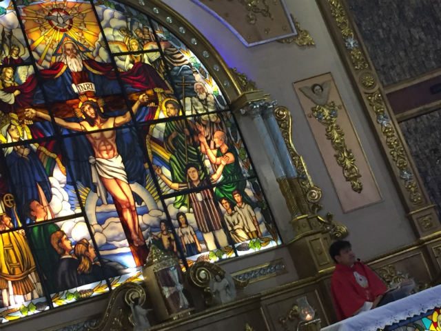LOOK WHO'S THERE. The image of Richie Fernando, his arms raised, is included in the stained glass retablo (lower right portion) at Mary the Queen Parish in Novaliches, Quezon City, a few steps away from the Fernandos' residence. Photo by Paterno Esmaquel II 