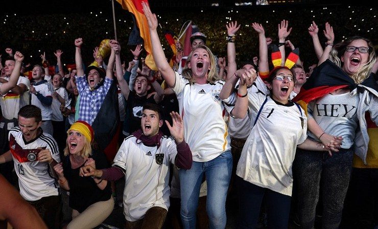 Fans celebrate as Germany wins the FIFA World Cup 2014 vs Argentina during an outdoor viewing at the Olympic stadium in Munich. Photo by Christof Stache/AFP