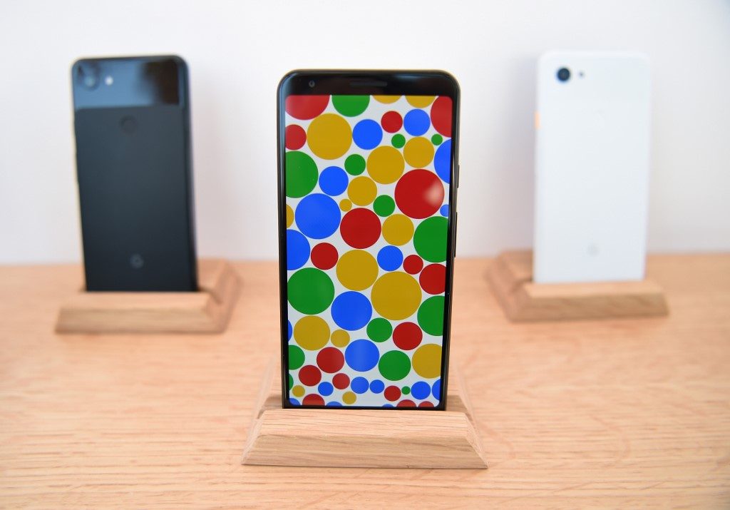 A new Google Pixel 3a phone (C) is displayed during the Google I/O conference at Shoreline Amphitheatre in Mountain View, California on May 7, 2019. Photo by Josh Edelson/AFP 