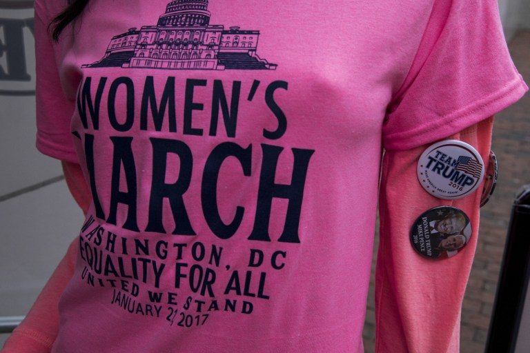WOMEN'S MARCH. A t-shirt on a mannequin wearing a Women's March and Donald Trump buttons is pictured before President-elect Trump's inauguration January 20, 2017 in Washington, DC. Zach Gibson/AFP 