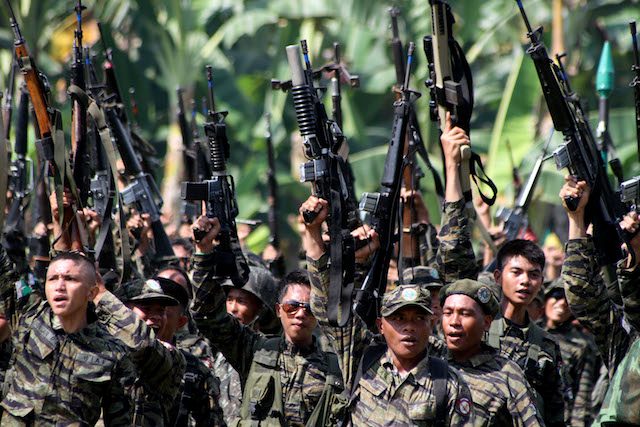 ARMED STRUGGLE. File photo of Moro Islamic Liberation Front combatants in the rebel's stronghold, Camp Darapanan. Photo by Amiel Meneses/EPA 