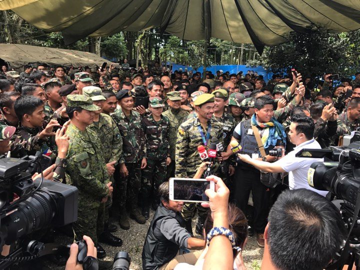 WAR ZONE. A smiling Senator Pacquiao is surrounded by troops as he speaks to the press in Camp Ranao, Marawi City on July 29. Photo courtesy of Westmincom.  
