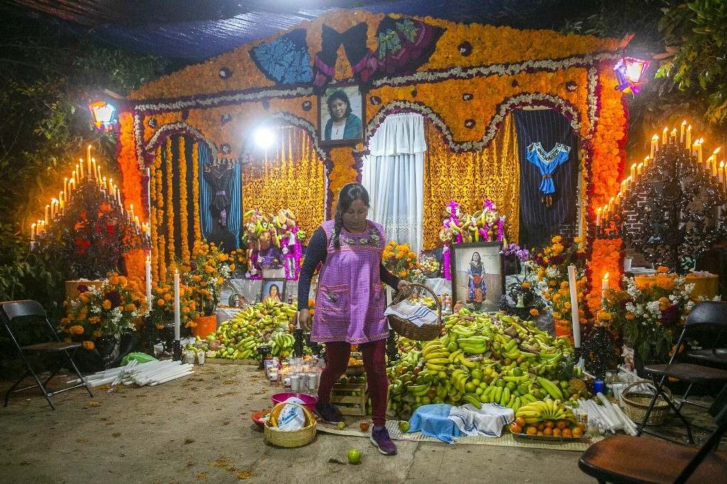 CELEBRATION. People place offerings in their houses for those who passed away during the year. Photo by Enrique Castro/AFP 