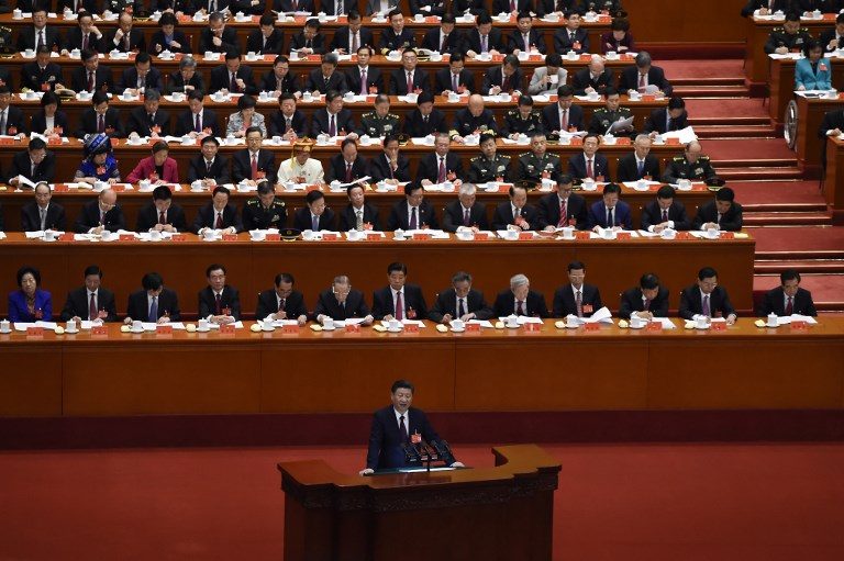 XI JINPING. China's President Xi Jinping gives a speech at the opening session of the Chinese Communist Party's five-yearly Congress at the Great Hall of the People in Beijing on October 18, 2017.  Photo by Wang Zhao/AFP 