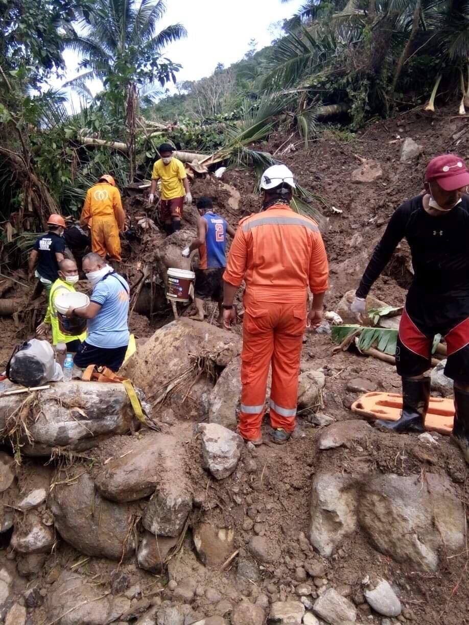 LANDSLIDE. Residents, policemen and rescue teams assess the landslide area in Barangay Patitinan, Sagñay, Camarines Sur. Photo courtesy of Radel Chavez Jr 