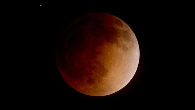 LUNAR ECLIPSE. The moon is seen as it nears a total lunar eclipse on April 15, 2014 in Burbank, California. Photo by Kevin Winter/Getty Images/AFP