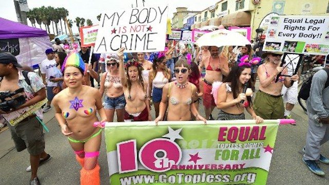 Topless activists parade through New York