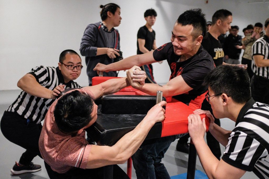 Chinese arm wrestling yanks hard for recognition