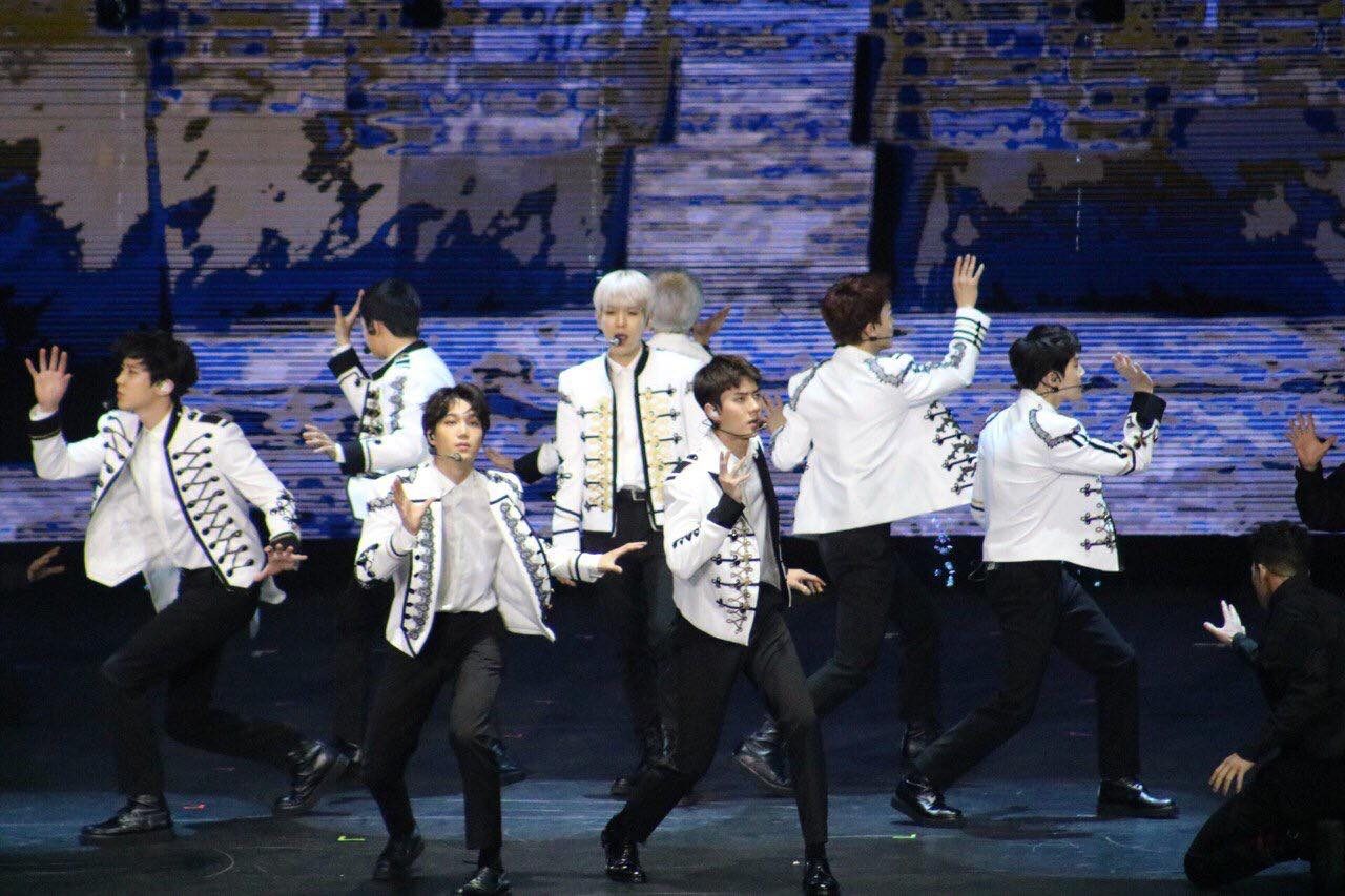 EXO. Korean-pop boyband EXO in their gold embellished white drummer boy coats during 'The ElyXiOn' concert in Manila. Screenshot from Twitter.com/@MOAArena 