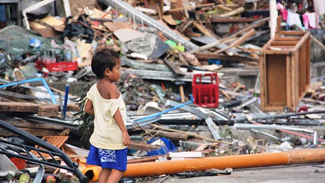 WHERE TO? A child walks in the rubble after supertyphoon Yolanda ravaged central Philippines. Photo by April Sumaylo/Save the Children. 