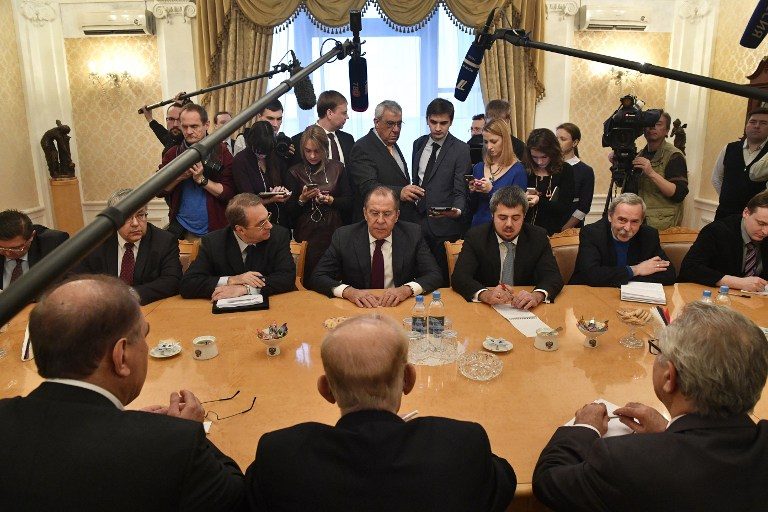 POSTPONED? Russian Foreign Minister Sergei Lavrov (C) meets with representatives of Syria's political opposition (bottom) in Moscow on January 27, 2017. Photo by Alexander Nemenov/ AFP 