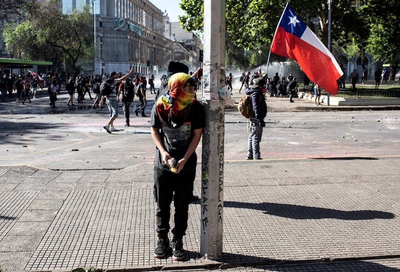 New clashes as embattled Chile president reshuffles cabinet