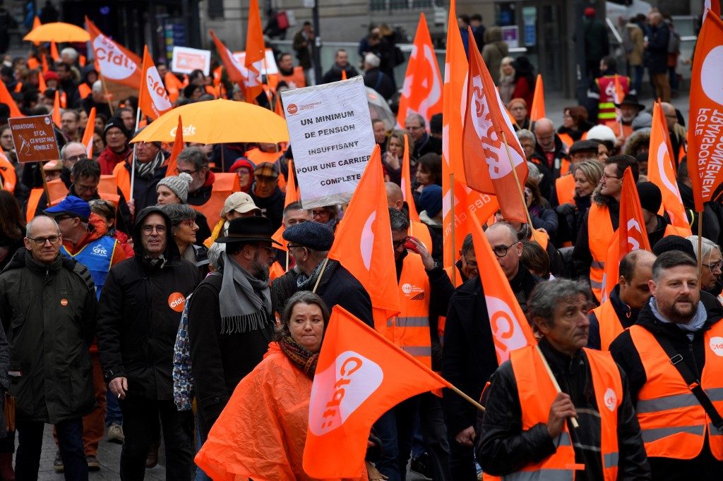 Hundreds of thousands protest in France over pension reform plans