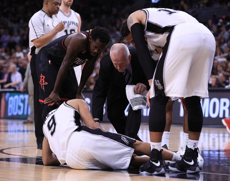 Tony Parker goes down hurt as Spurs win Game 2