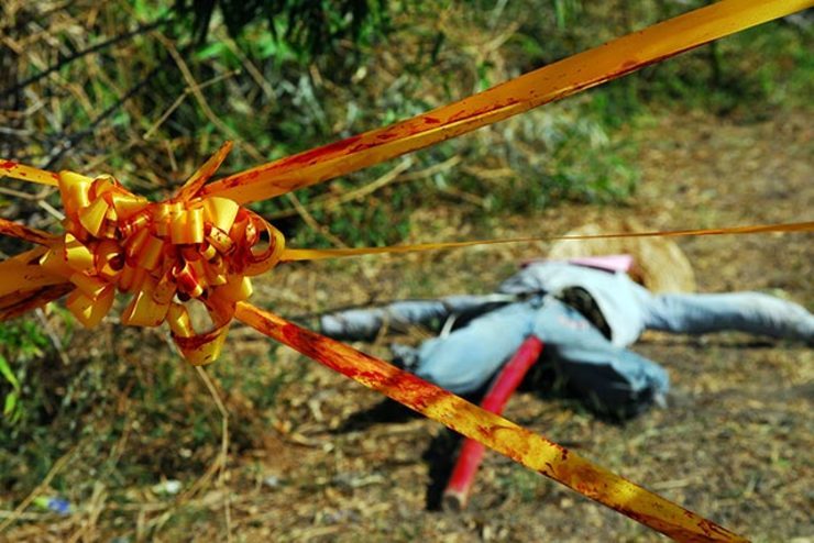 YELLOW RIBBON. Tainted in red symbolizing the continued harassment of farm-worker benificiaries by security guards of Hacienda Luisita.
