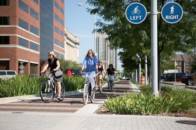 INDEPENDENT IN INDIANAPOLIS. Protected lanes encourage women to hop on the bike saddle. Photo courtesy of PeopleForBikes 