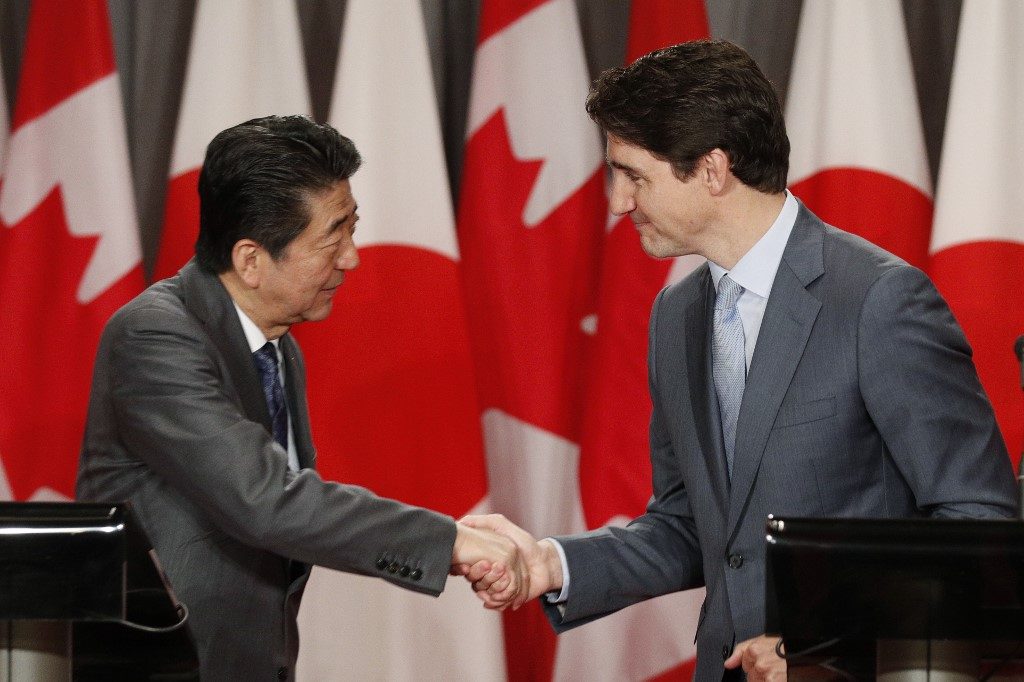 Abe, Trudeau extol Pacific trade pact without U.S.