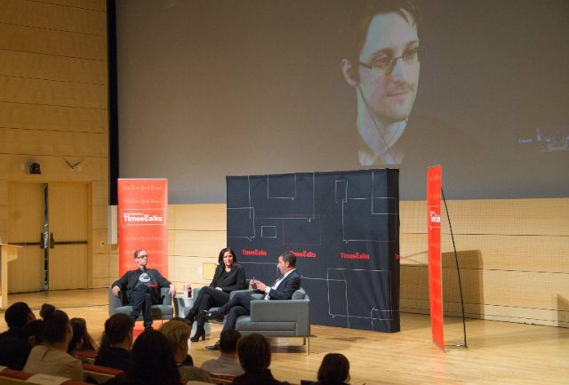FIGHTING SURVEILLANCE. The late New York Times Columnist David Carr, filmmaker Laura Poitras, journalist Glenn Greenwald and National Security Agency whistleblower Edward Snowden (via video) attend the TimesTalks at The New School on February 12, 2015 in New York City. Photo by Mark Sagliocco/AFP  