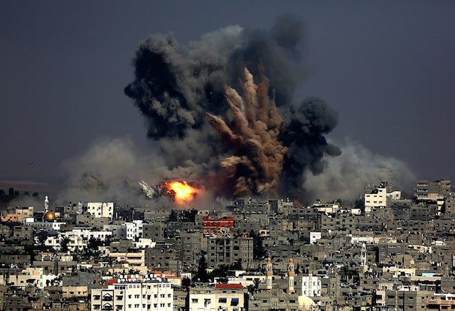 HIT. Smoke rises from Tuffah neighborhood after Israeli air strikes in the east of Gaza City, 29 July 2014. Mohammed Saber/EPA