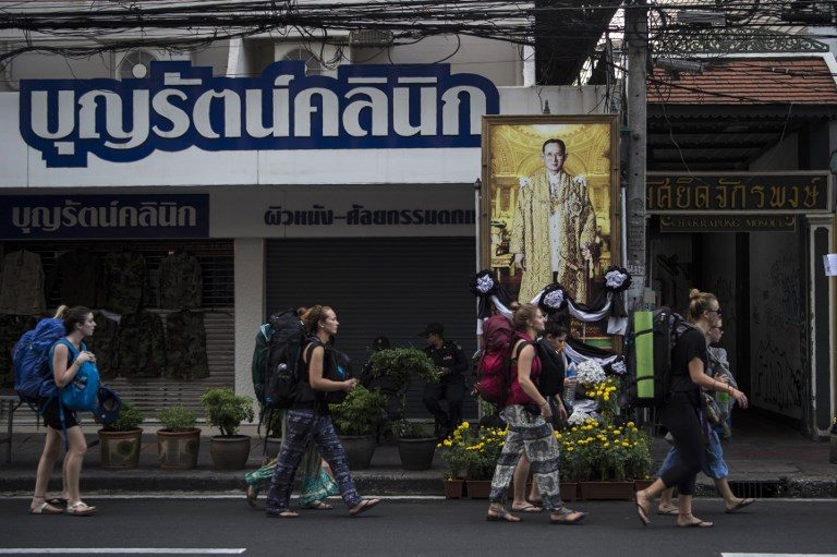 Tourists bemused as Bangkok sobers up for Thai king funeral