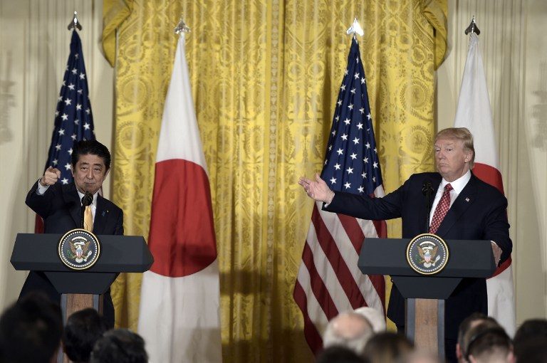 Trump welcomes Abe with warm White House embrace