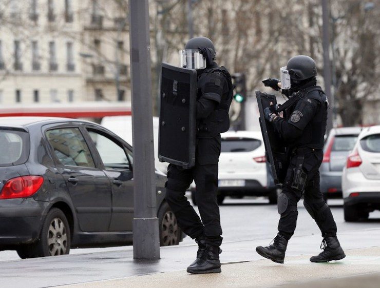 ON GUARD. Members of the French police special force RAID walk to take a position on January 9, 2015 in Saint-Mande, near Porte de Vincennes, eastern Paris, after at least one person was injured when a gunman opened fire at a kosher grocery store on January 9, 2015 and took at least five people hostage, sources told AFP. Thomas Samson/AFP