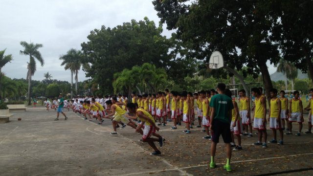 Students run basketball drills under the supervision of a coach. Photo by Mars G Alison/Rappler  