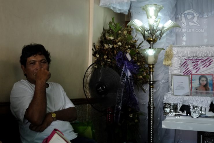 STEP FATHER. Jennifer Laude's step father Franco Cabillan mans her wake Friday morning, October 24. Cabillan had seen Laude grow, after living with his mom since she was aged 3. Photo by George Moya/Rappler