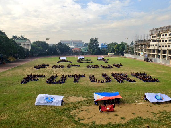 Youth form human banner for #NowPH climate action day