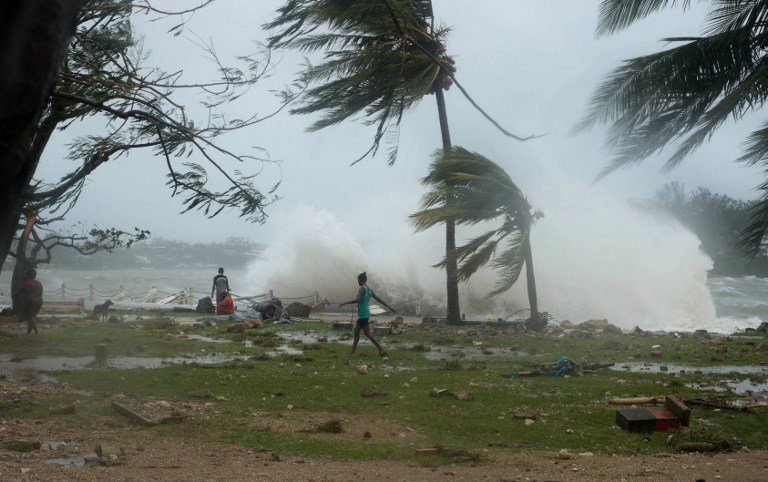 This handout photo taken and received on March 14, 2015 by UNICEF Pacific shows waves and scattered debris along the coast, caused by Cyclone Pam, in the Vanuatu capital of Port Vila. The huge tropical cyclone smashed into Vanuatu in the South Pacific, terrifying residents and leaving 'complete devastation' with fears on March 14 that dozens of people may have died. UNICEF Pacific / AFP 