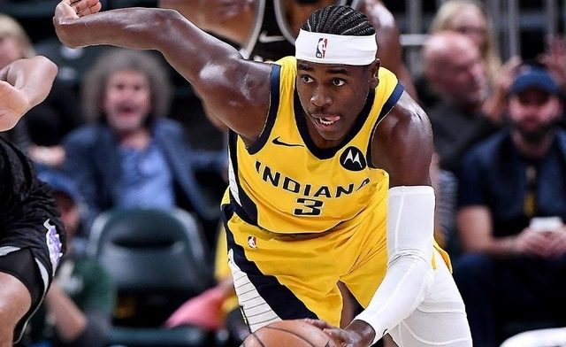 Holiday shines as Pacers edge Raptors in OT