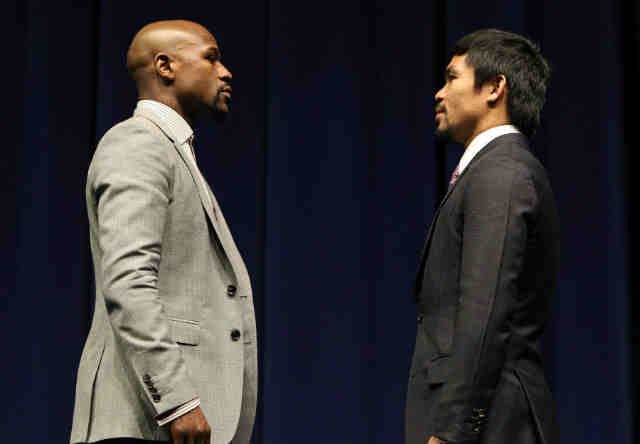 FACE TO FACE. Floyd Mayweather Jr (L) and Manny Pacquiao meet to announce the fight that critics said would never happen. Photo by Chris Farina/Top Rank  