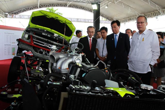 PLANT INAUGURATION. President Benigno S. Aquino III views locally-assembled cars displayed at the Mitsubishi Gallery during the plant's inauguration in Sta. Rosa, Laguna on January 29, 2015. File photo by Rey Baniquet/Malacañang Photo Bureau  