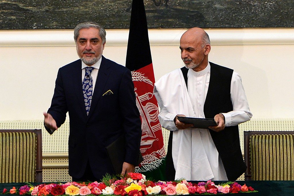 Afghan President Ghani, rival Abdullah sign power-sharing deal
