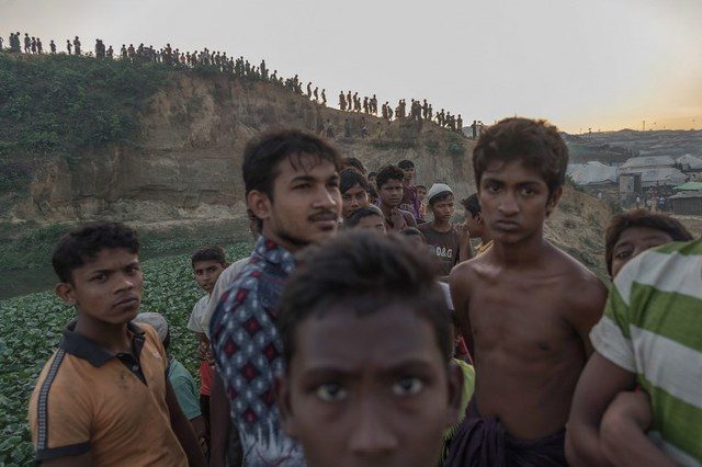 BLACK DAY. This picture taken on November 26, 2017 shows Rohingya Muslim refugees looking on near Kutupalong refugee camp in Cox's Bazar, Bangladesh. File photo by Ed Jones/AFP 