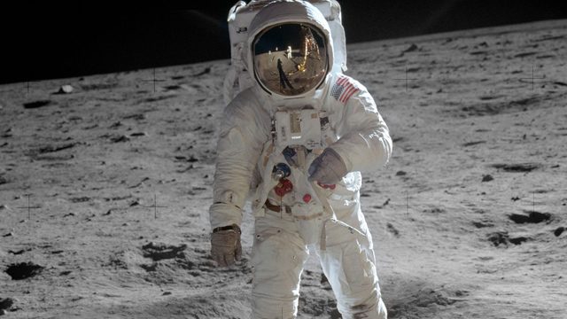 MAN ON THE MOON. US Astronaut Edwin 'Buzz' Aldrin is shown walking near the Lunar Module 20 July 1969 during the Apollo 11 space mission. Visible as a reflection in Aldrin's visor is Neil Armstrong, the man who took the photo. Photo by NASA 