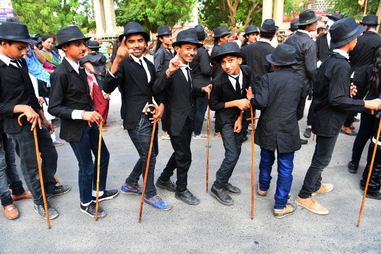 The Great Impersonators: Charlie Chaplin fans parade through town in India