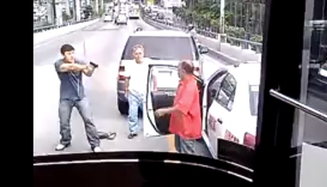 Caught on video: Man points gun at taxi driver