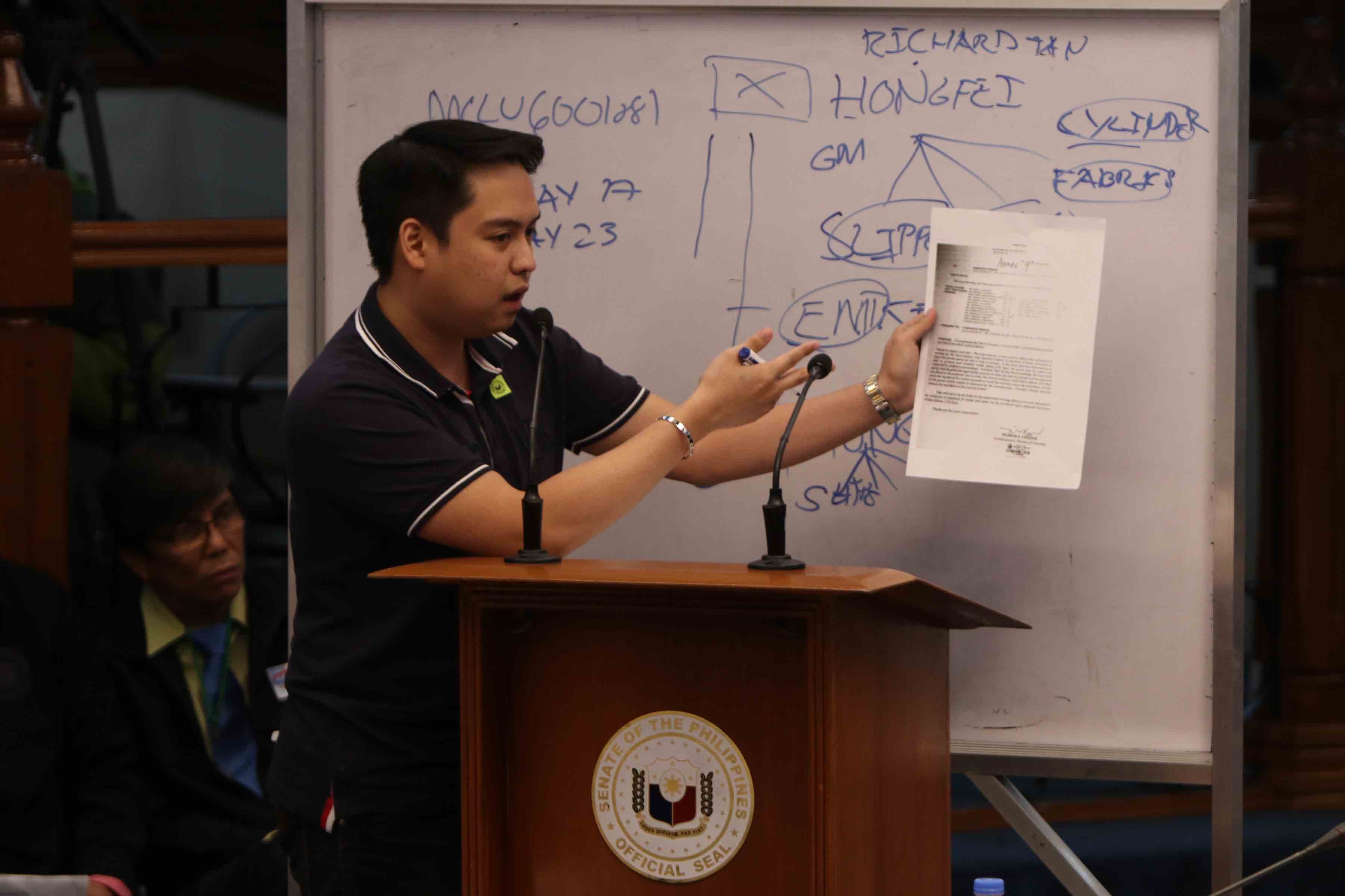 PROTECTION. The Senate blue ribbon committee places customs broker Mark Ruben Taguba under the Senate's protective custody following his statements in an executive session on the P6.4-billion shabu shipment from China. Photo by Lito Boras/Rappler 