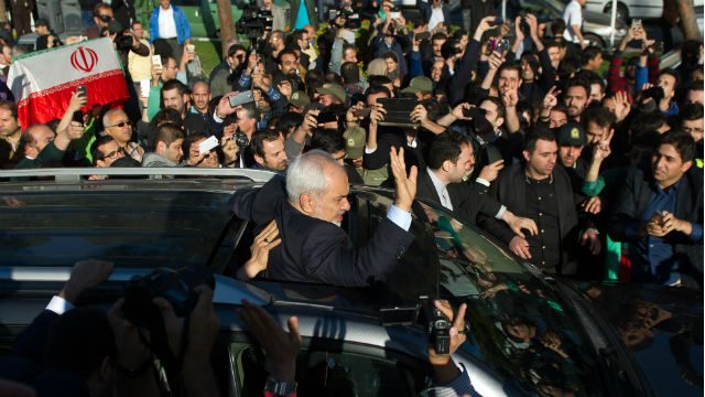 Crowd hails Iranian nuclear negotiators on return to Tehran